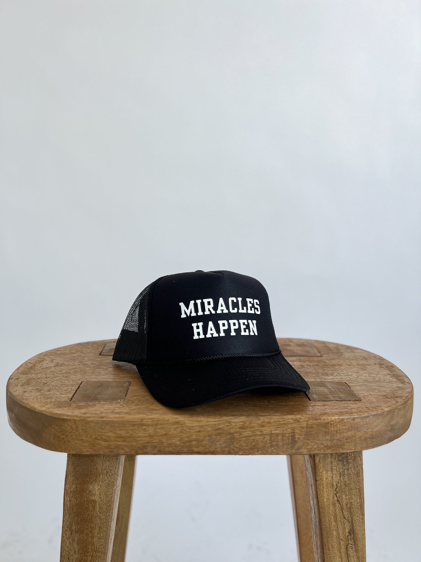 MIRACLES HAPPEN TRUCKER HAT // BLACK